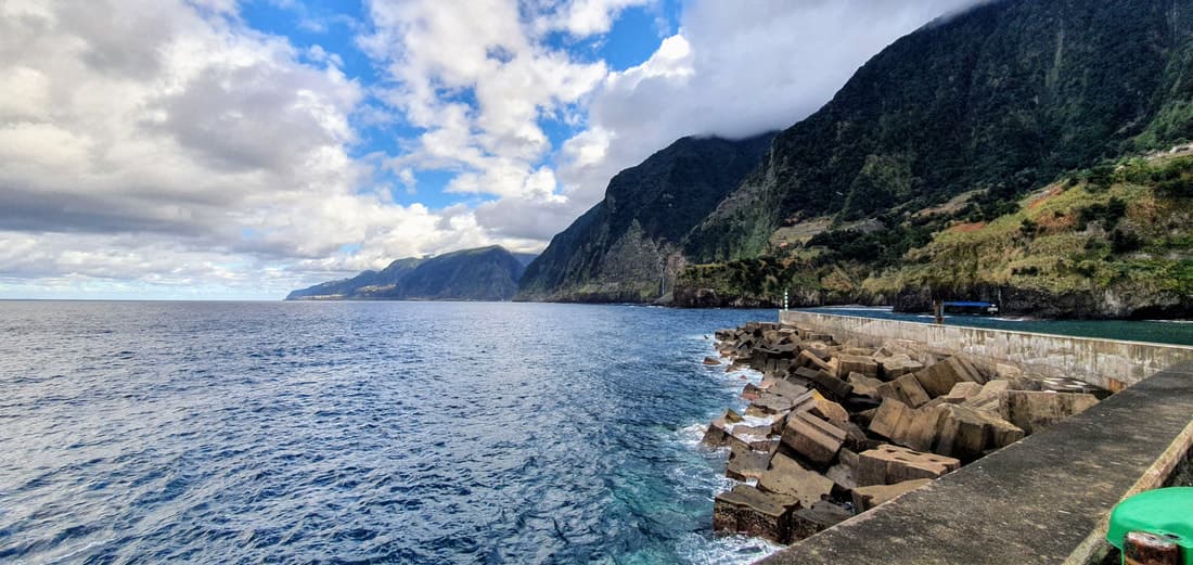 The pier and breakwater at Seixal beneath the north coast cliffs