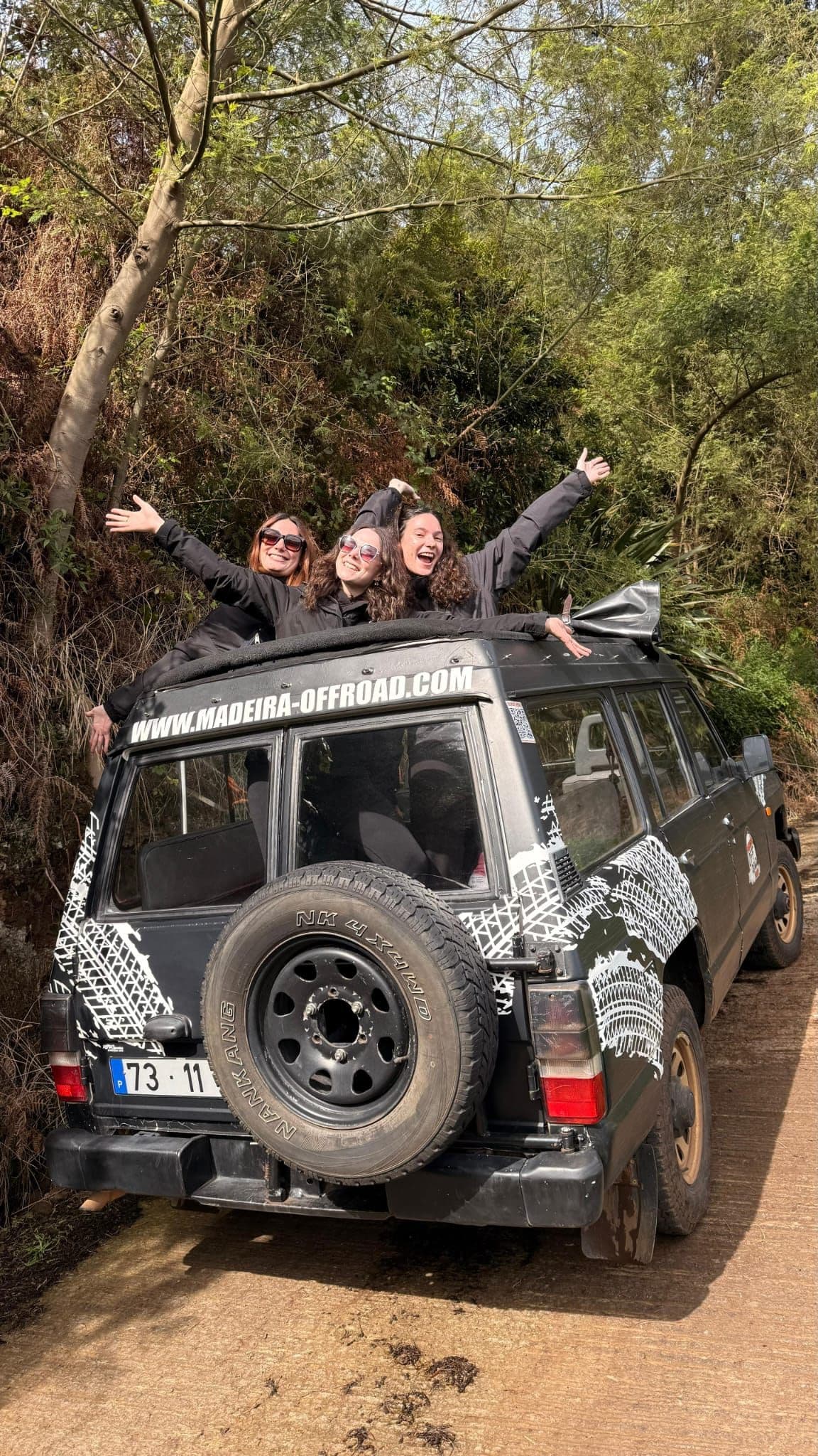 Guests cheering from the open-roof Nissan Patrol