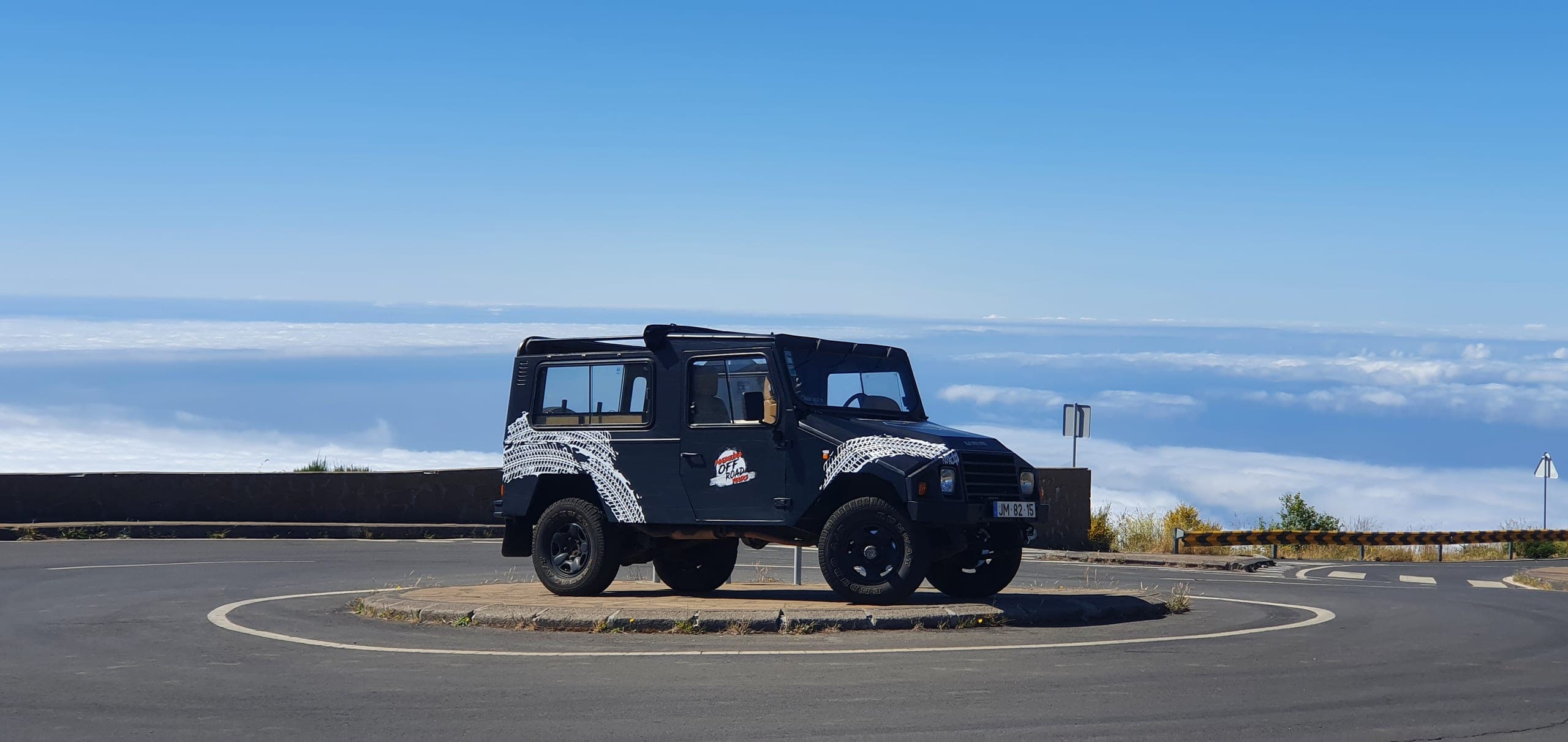 The Madeira Off Road Jeep at a mountain turning circle high above the clouds
