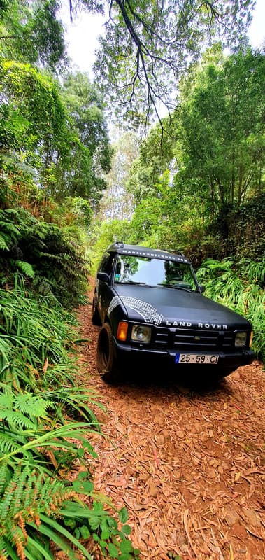 An off-road Jeep at a remote mountain viewpoint above Madeira's north coast